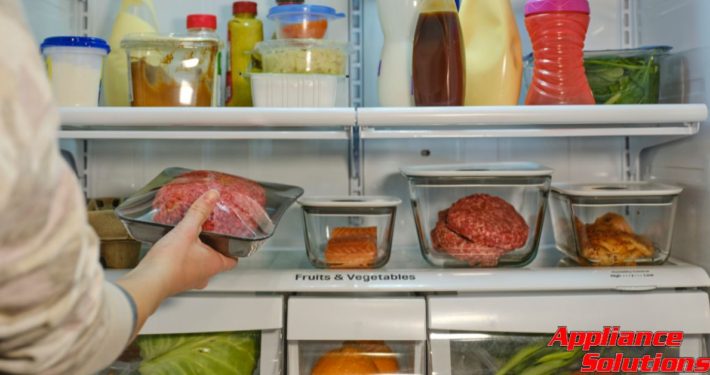 interior of fridge with fruits and vegetables - Appliance Solutions