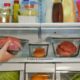 interior of fridge with fruits and vegetables - Appliance Solutions