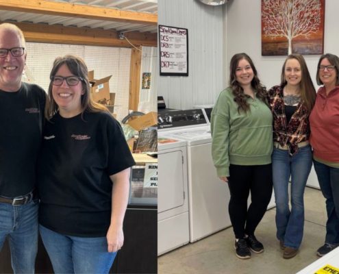 employees standing together in a warehouse setting - Appliance Solutions home appliances near me
