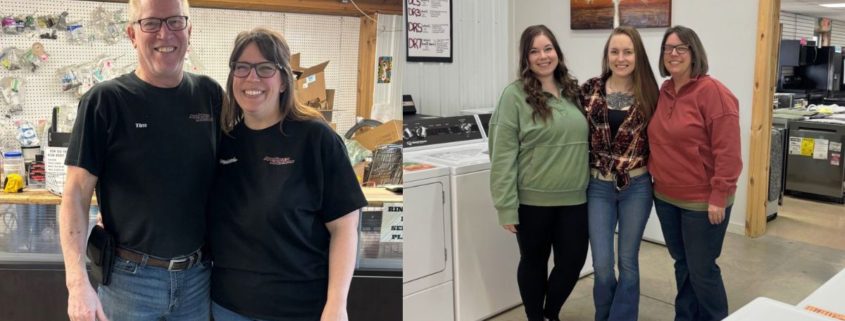 employees standing together in a warehouse setting - Appliance Solutions home appliances near me